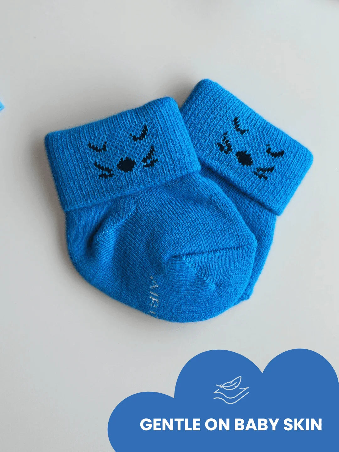 Air Garb high-quality cotton baby combo socks for ages 0-1 years; features three pairs of socks in lime green, royal blue, and deep purple with embroidered kitten faces on the cuffs.